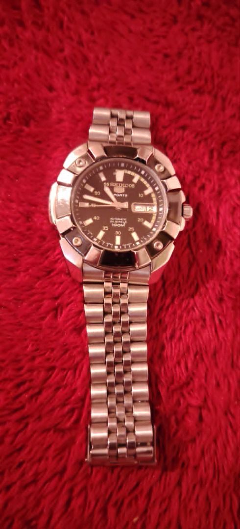 Seiko 5 Sports Automatic Watch (Category: Men's Watches) located in Cavite. Submitted by blackrain4 (Listing ID 1435707298, Image 2). Description: - Seiko 5 Sports automatic watch - Stainless steel bracelet - Black dial - Day and date display - Unique case design with rotating bezel - Transparent case back - Seiko logo on clasp.