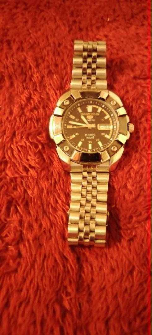Seiko 5 Sports Automatic Watch (Category: Men's Watches) located in Cavite. Submitted by blackrain4 (Listing ID 1435707298, Image 3). Description: - Seiko 5 Sports automatic watch - Stainless steel bracelet - Black dial - Day and date display - Unique case design with rotating bezel - Transparent case back - Seiko logo on clasp.