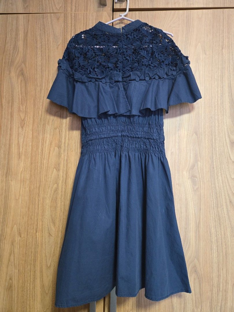 Self-Portrait Navy Dress (Category: Dresses) located in Pasig City. Submitted by izzy0202 (Listing ID 1435618612, Image 2). Description: - Self-Portrait navy dress - Features a lace bodice - Ruffled detailing - Fitted waist - Button details on the side - Short sleeves - UK size 6.