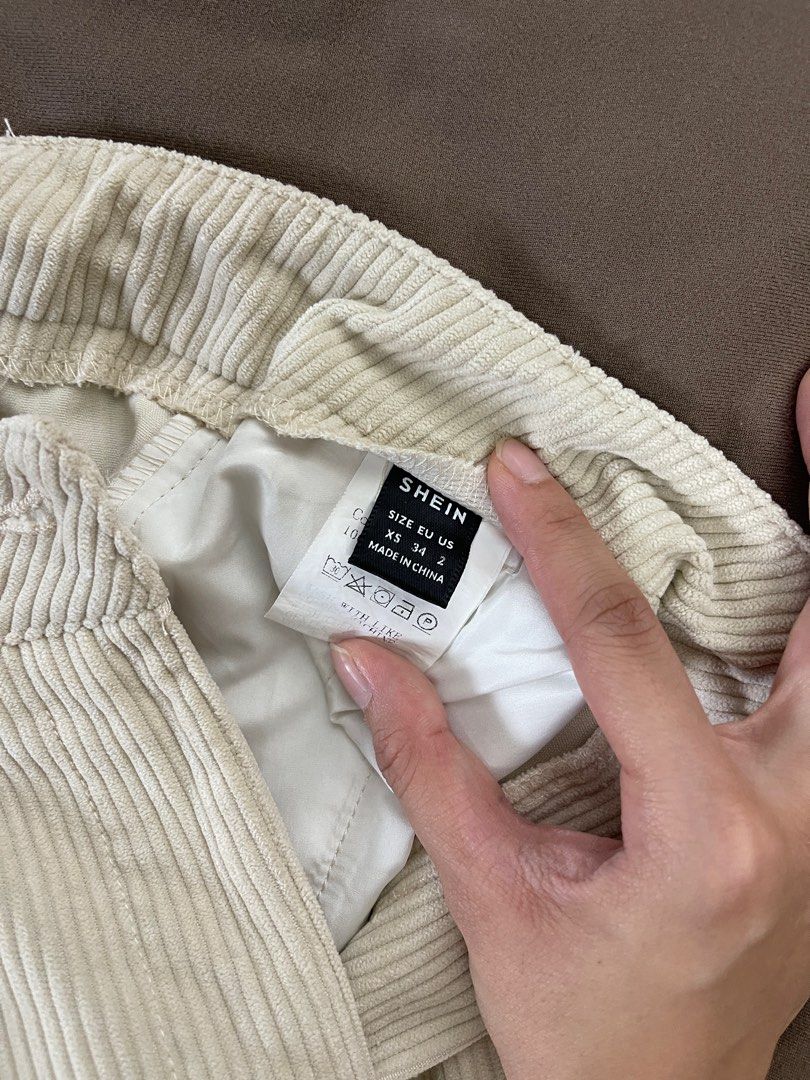 Shein Corduroy Pants XS (Category: Other Bottoms) located in Cavite. Submitted by ellanierva (Listing ID 1435573879, Image 3). Description: - Shein cream corduroy pants - Size: XS (EU 34) - Features: Button closure, pleated front - Fit: Relaxed with straight leg - Worn once.