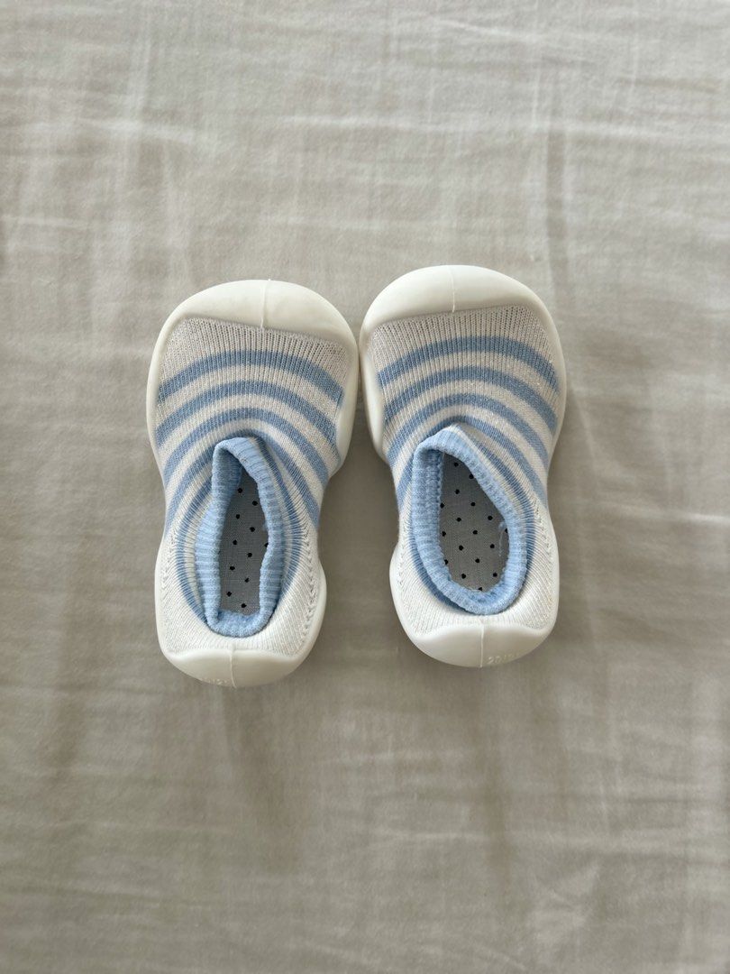 Soft insole baby shoes/socks (Category: Babies & Kids Fashion) located in Quezon City. Submitted by jen_o (Listing ID 1435529844, Image 1). Description: - White and light blue striped design - Soft and flexible sole - Dotted interior for comfort - Textured sole for grip - Easy to wear.