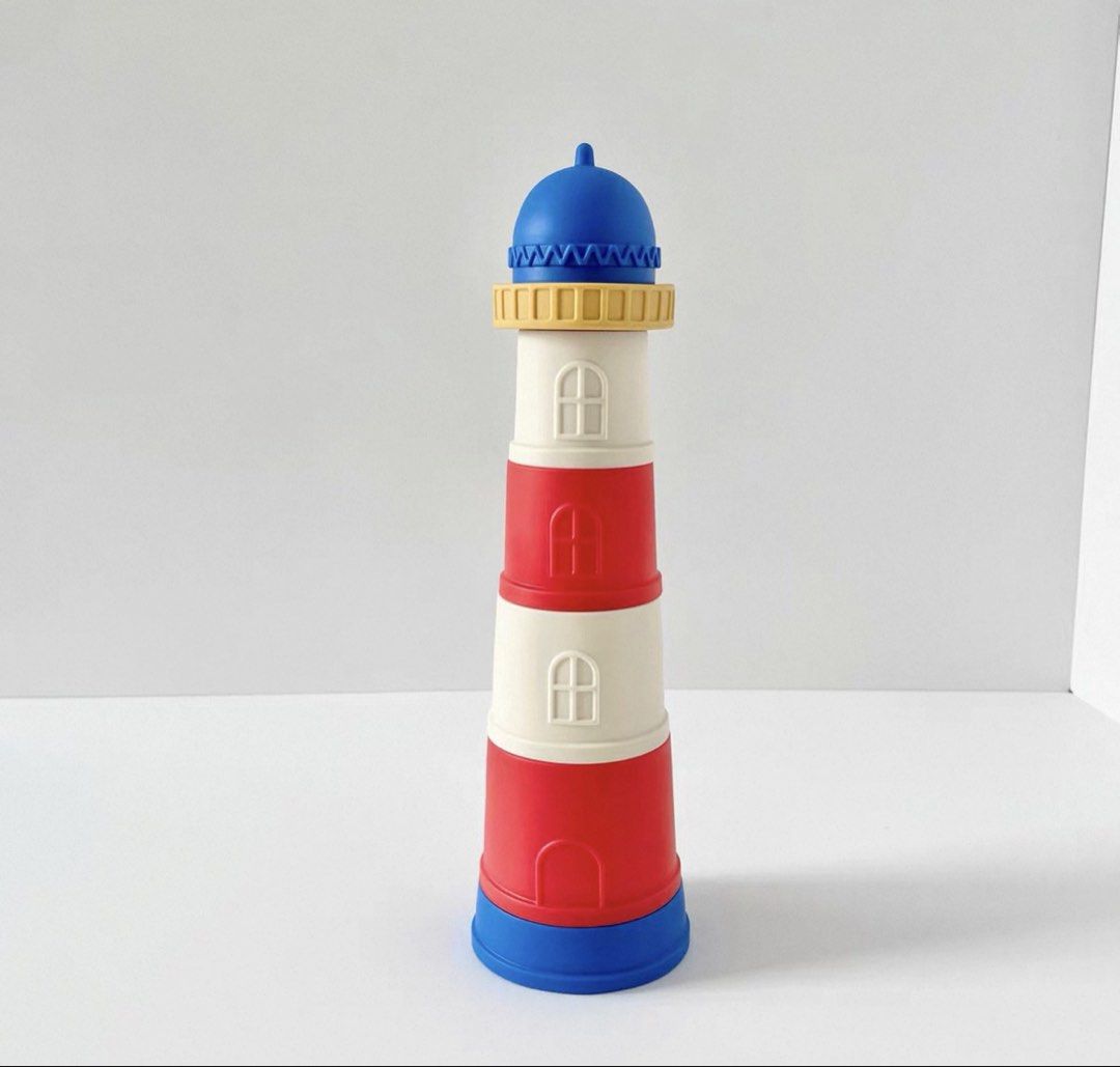 Stackable Lighthouse Toy (Category: Educational & Learning Toys) located in Singapore. Submitted by pineco (Listing ID 1435650321, Image 1). Description: Colorful lighthouse stacking toy for toddlers. Very good condition .