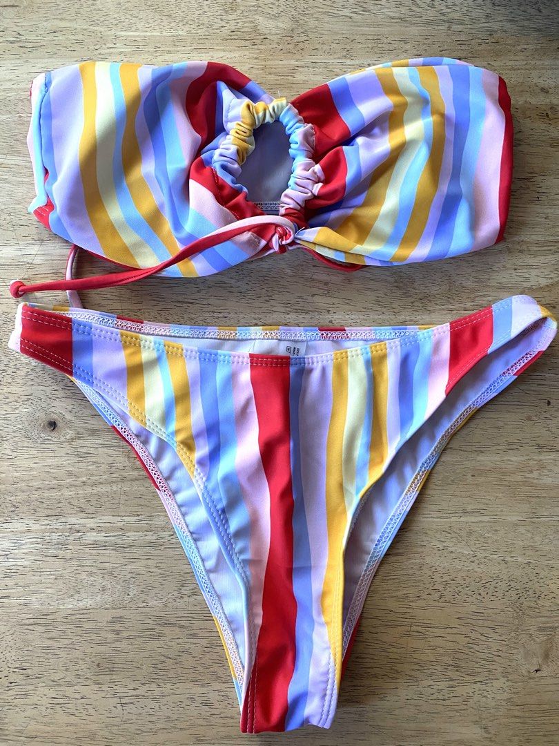 Striped Bikini Set (Category: Bikinis & Swimsuits) located in Carmona. Submitted by cheesecake_21 (Listing ID 1435592134, Image 1). Description: - Striped bikini set - Bandeau top with gathered center - Classic-cut bottoms - Smooth swimwear material - Colors: Red, yellow, blue, purple stripes.