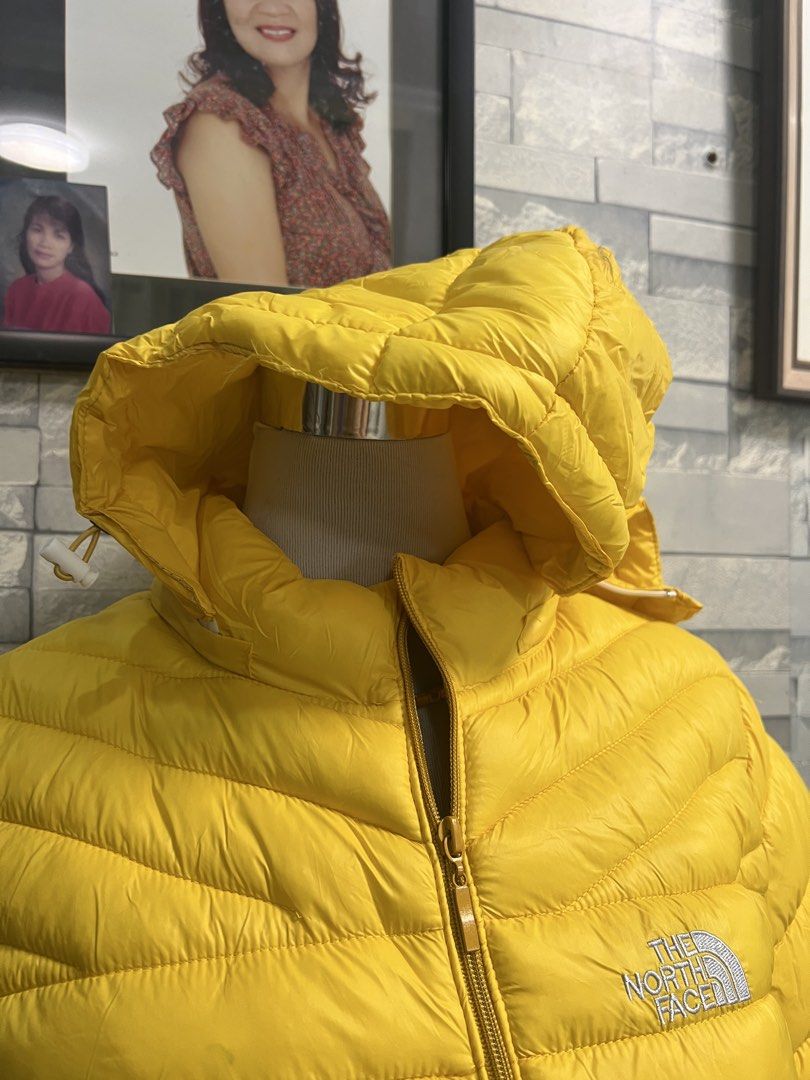 The North Face Yellow Puffer Jacket (Category: Coats, Jackets and Outerwear) located in Antipolo. Submitted by murapod2 (Listing ID 1435523730, Image 2). Description: Bright yellow puffer jacket from The North Face. Features a hood and a zip-up front. The North Face logo is visible on the chest. The jacket has "GORE-TEX Performance Shell" printed on the sleeve..