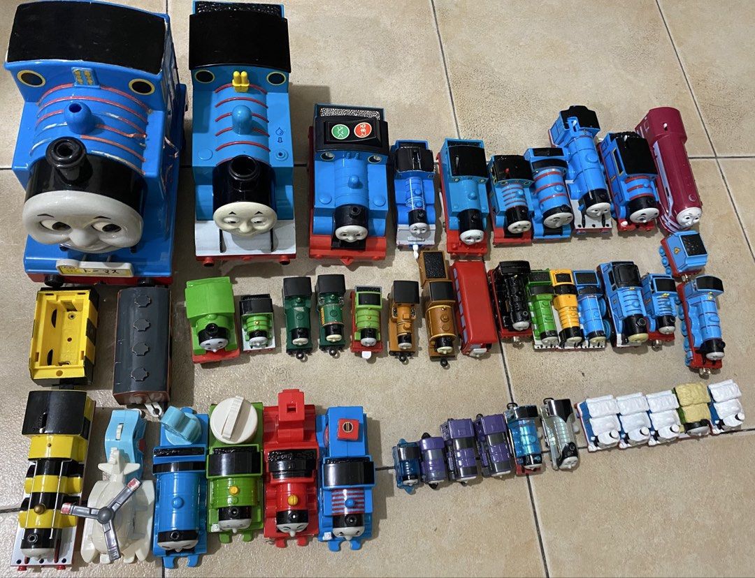 Thomas & Friends Toy Train Collection (Category: Vehicle & Diecast Models) located in Quezon City. Submitted by declutterthingzzz (Listing ID 1435712418, Image 3). Description: - Large collection of Thomas & Friends toy trains. - Includes Thomas the Tank Engine models and other characters. - Features various train cars and designs. - Different sizes available. - Some trains show wear, others are in better condition. - Perfect for any Thomas & Fri