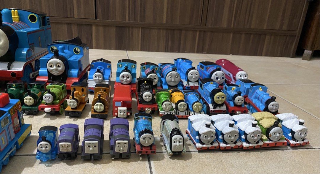 Thomas & Friends Toy Train Collection (Category: Vehicle & Diecast Models) located in Quezon City. Submitted by declutterthingzzz (Listing ID 1435712418, Image 1). Description: - Large collection of Thomas & Friends toy trains. - Includes Thomas the Tank Engine models and other characters. - Features various train cars and designs. - Different sizes available. - Some trains show wear, others are in better condition. - Perfect for any Thomas & Fri