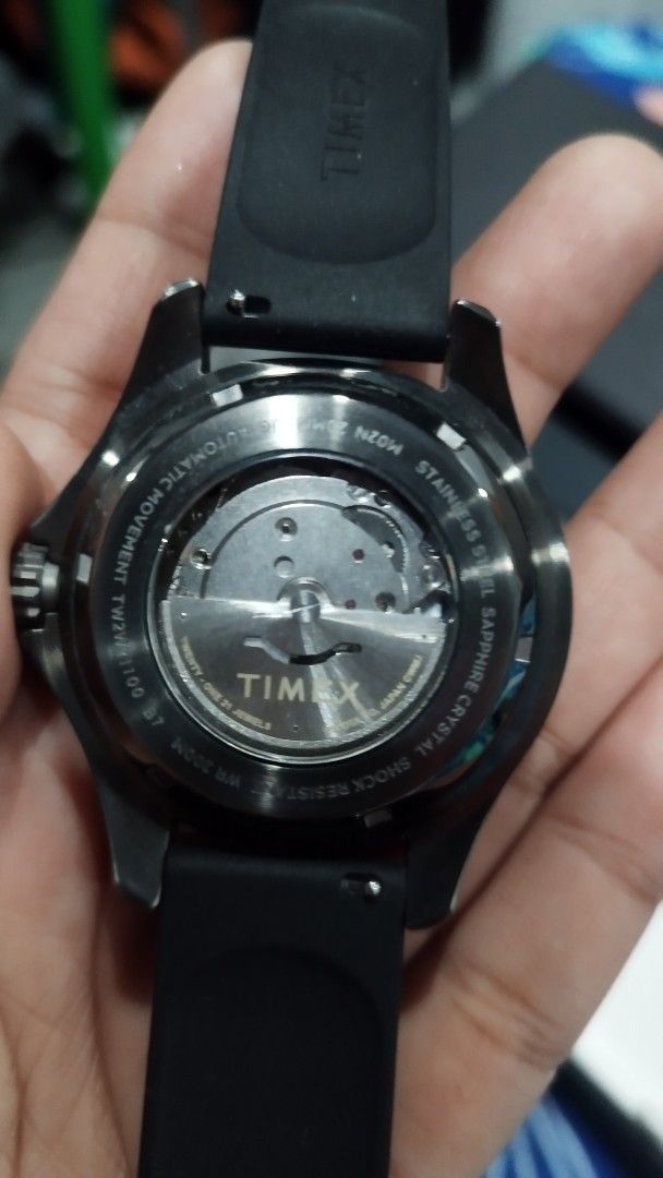 Timex Tiburón Automatic (Model: TW2W21100ZV) (Category: Men's Watches) located in Makati City. Submitted by icesena09 (Listing ID 1435534146, Image 3). Description: Key Features & Specs:Movement: Automatic mechanical (self-winding) with a 3-hand analog display. Case: 44mm stainless steel with a gunmetal or black finish, uni-directional rotating bezel, and screw-down crown.Crystal: Scratch-resistant sapphire crystal with a date magnifier. Dial: Bl