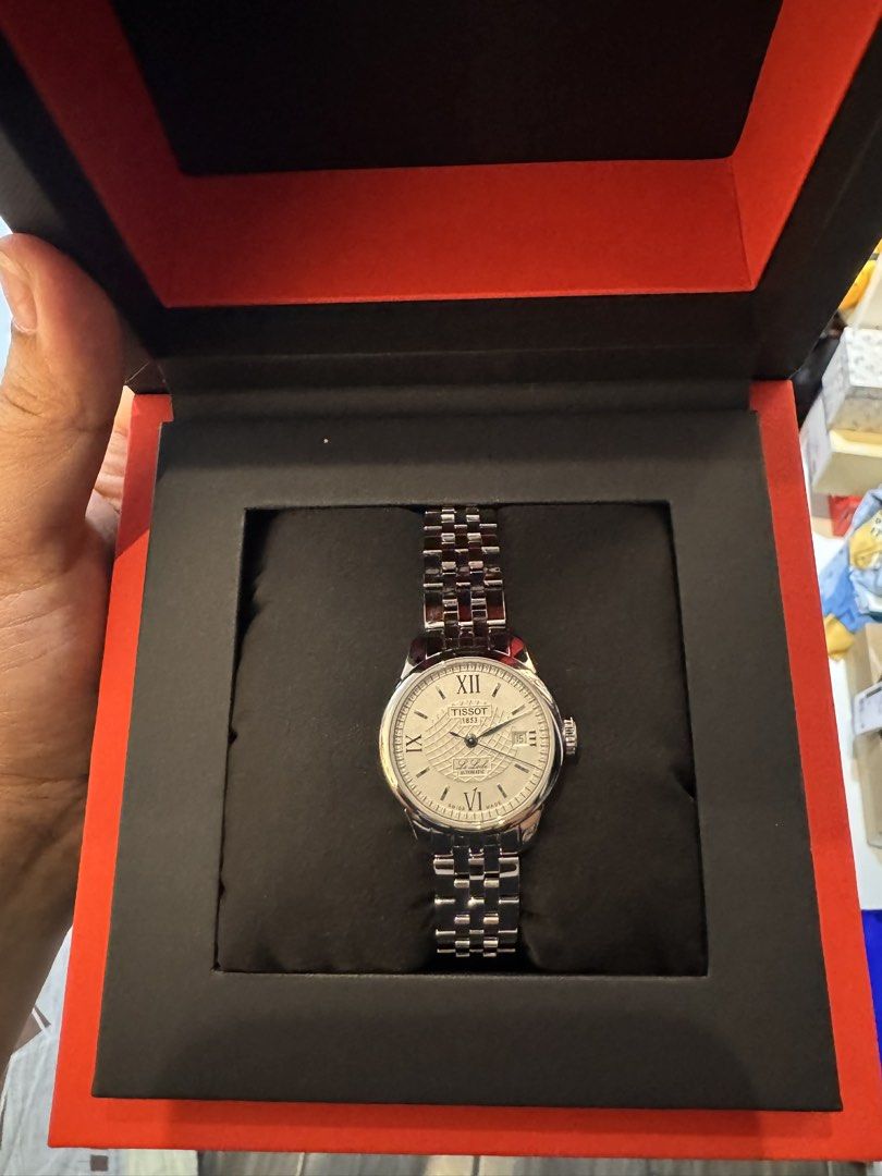 Tissot Carson Premium Automatic Watch (Category: Luxury Watches) located in Marilao. Submitted by anp129 (Listing ID 1435553189, Image 3). Description: - AUTHENTIC Tissot Le Locle Automatic T41.1.183.33 watch - Features a silver dial. - Roman numeral hour markers. - Date display at 3 o'clock. - Stainless steel bracelet and case. - Comes with original Tissot box. - Bought from Japan 🇯🇵 - Stylish and suitable for any occasion..