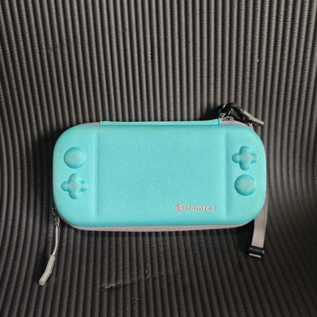 Tomtoc Carrying Case for Nintendo Switch Lite (Category: Cases & Covers) located in Quezon City. Submitted by shopme_gadget30 (Listing ID 1435666930, Image 1). Description: kindly read the details first for sale fixed price good Condition compatible to Nintendo switch Lite Only tomtoc Original Shoopppppeee —,✅ can check out pm for the linnnkkk (If shoopppee check out, price is higher because of shooppppeee deduction qc area meet up: sm north ship