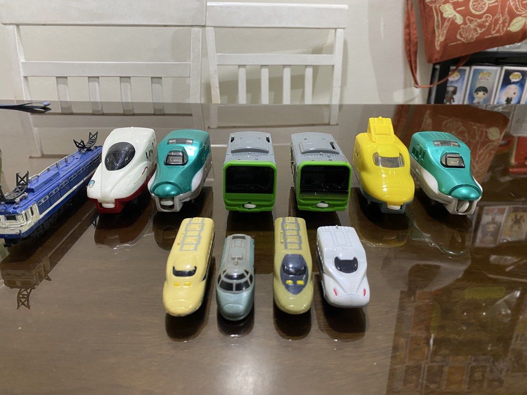 Toy Train and Car Collection (Category: Vehicle & Diecast Models) located in Quezon City. Submitted by declutterthingzzz (Listing ID 1435712763, Image 1). Description: - Variety of toy train models in different colors and designs. - Some are from Mcdonalds - Includes a silver SUV. - Features a white sedan. - Also includes a dark purple minivan. - Ideal for collectors and kids who enjoy playing with toy vehicles. Price starts at 70.