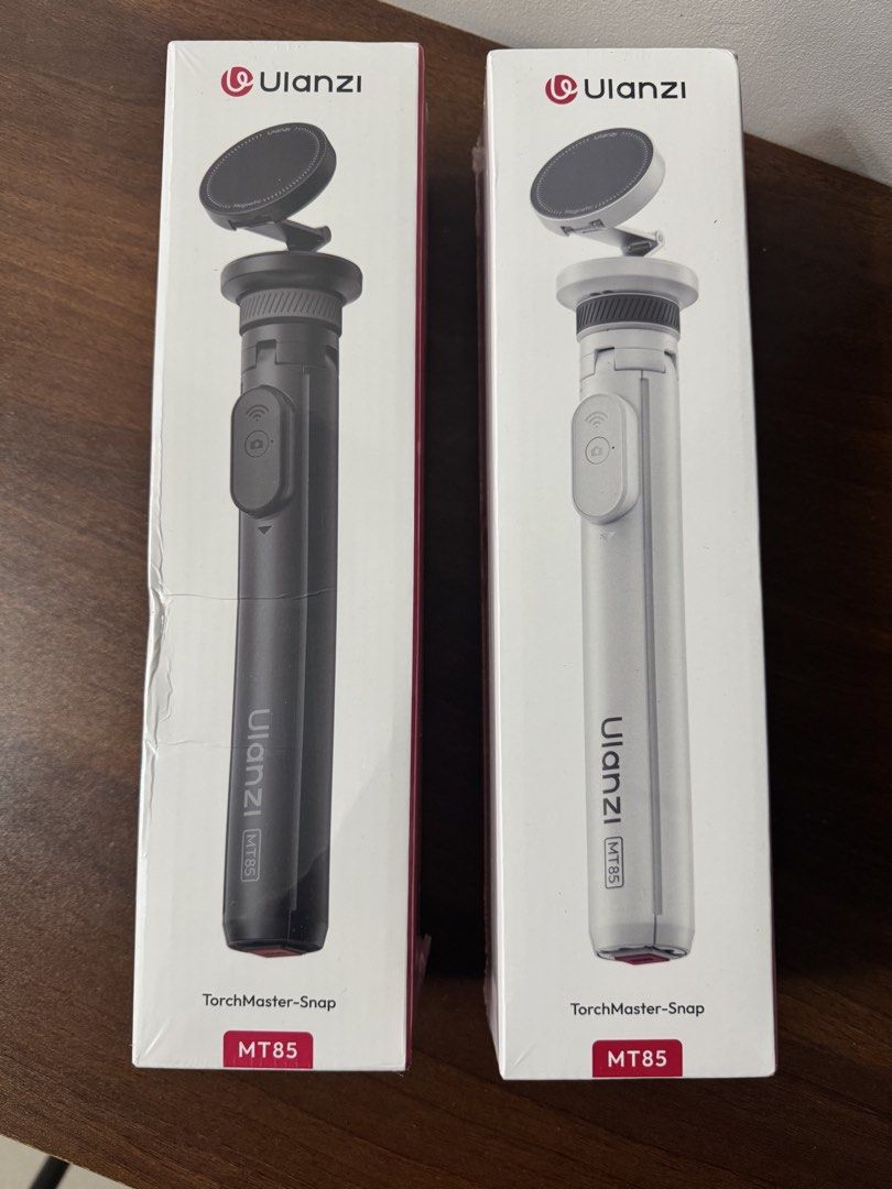 Ulanzi MT85 TorchMaster-Snap Tripod (Category: Tripods & Monopods) located in Makati City. Submitted by itsjmla (Listing ID 1435554328, Image 1). Description: - Ulanzi MT85 TorchMaster-Snap Tripod - Features a magnetic phone mount - Includes a built-in remote control - Available in Black and White - Compact and portable design - Ideal for content creators and mobile photographers - Easy setup and use.