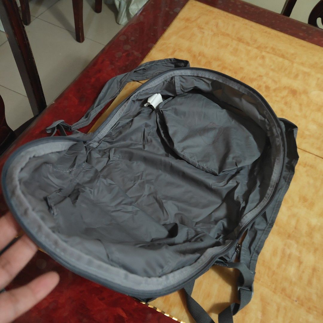 Under Armour Foldable Backpack (Category: Backpacks) located in Valenzuela. Submitted by annamagabo (Listing ID 1435559531, Image 3). Description: - Under Armour foldable backpack - Gray exterior with pink accents - Zippered main compartment - Front zippered pocket - Adjustable straps - Top handle for easy carrying - Lightweight design - Under Armour logo displayed.