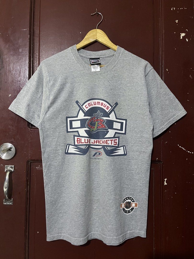 Vintage NHL Columbus Blue Jacket Team (Category: Tshirts & Polo Shirts ) located in San Pedro. Submitted by re_value.ph (Listing ID 1435674444, Image 1). Description: VINTAGE NHL size: Tall Medium Excellent condi issue: minor color transfer sa lettering ng “Columbus” SOLID neck line solid fittings.