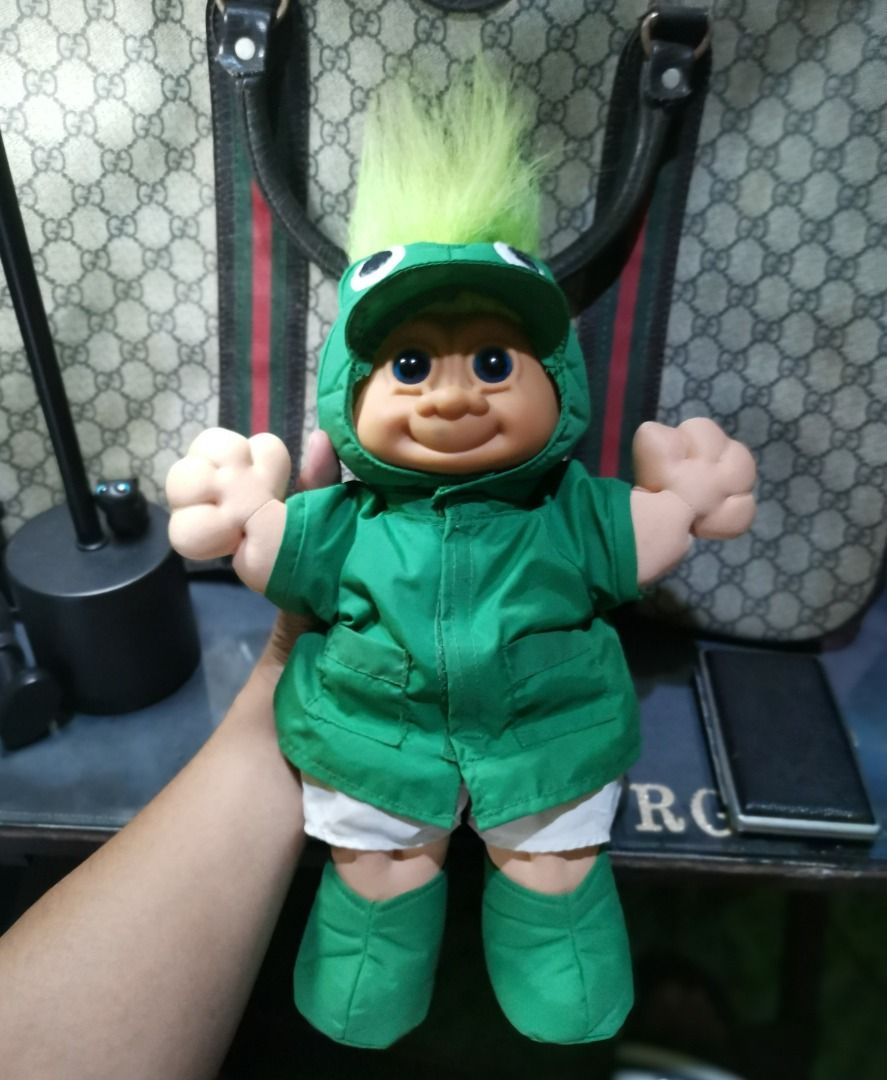 Vintage Troll Doll "FROGGIE" (Category: Figurines & Statues) located in Caloocan City. Submitted by timtuss420 (Listing ID 1435542106, Image 1). Description: -NEGOTIABLE NEGOTIABLE NEGOTIABLE - Vintage Troll doll - Dressed in a green jacket, shorts, and boots - Features a green mohawk - Smiling face and outstretched arms - Collectible item.