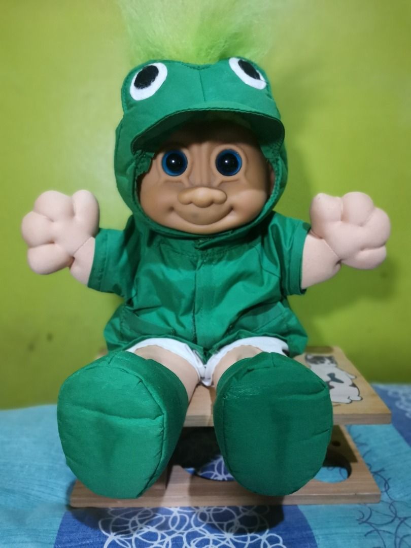 Vintage Troll Doll "FROGGIE" (Category: Figurines & Statues) located in Caloocan City. Submitted by timtuss420 (Listing ID 1435542106, Image 3). Description: -NEGOTIABLE NEGOTIABLE NEGOTIABLE - Vintage Troll doll - Dressed in a green jacket, shorts, and boots - Features a green mohawk - Smiling face and outstretched arms - Collectible item.