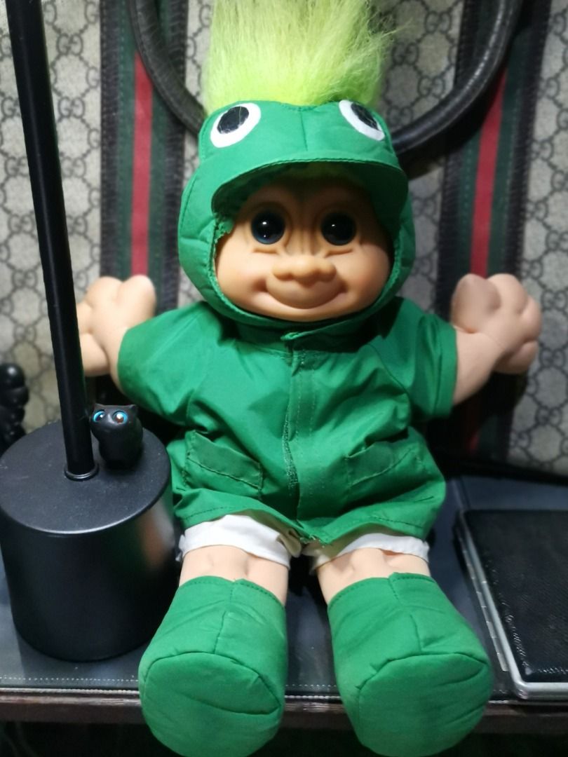 Vintage Troll Doll "FROGGIE" (Category: Figurines & Statues) located in Caloocan City. Submitted by timtuss420 (Listing ID 1435542106, Image 2). Description: -NEGOTIABLE NEGOTIABLE NEGOTIABLE - Vintage Troll doll - Dressed in a green jacket, shorts, and boots - Features a green mohawk - Smiling face and outstretched arms - Collectible item.