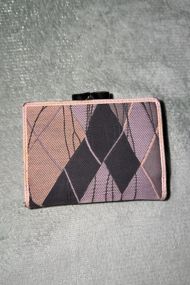 Vivienne Westwood Tri-fold Wallet (Category: Luxury Bags & Wallets) located in Makati City. Submitted by joshdelrey (Listing ID 1435702225, Image 2). Description: Vivienne Westwood Trifold Wallet - Negotiable - Needs Repainting - Makati .