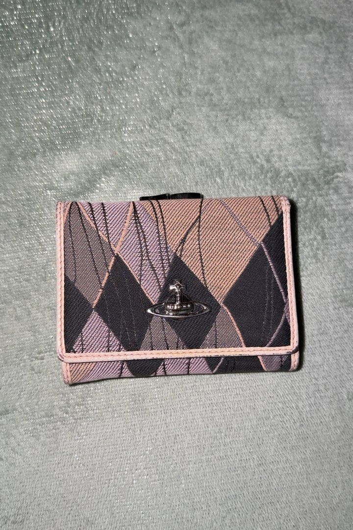 Vivienne Westwood Tri-fold Wallet (Category: Luxury Bags & Wallets) located in Makati City. Submitted by joshdelrey (Listing ID 1435702225, Image 1). Description: Vivienne Westwood Trifold Wallet - Negotiable - Needs Repainting - Makati .