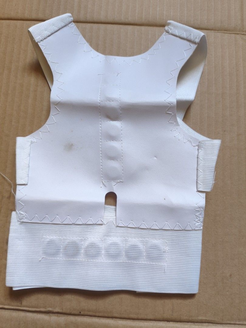 White Posture Corrector Back Brace (Category: Braces, Support & Protection) located in Pasig City. Submitted by coolphoenix-29ac (Listing ID 1435549539, Image 3). Description: - Adjustable straps for a customized fit - Vest-like design for comprehensive support - Made of soft, flexible material - Easy hook and loop closure - Designed to improve posture - Provides back support.