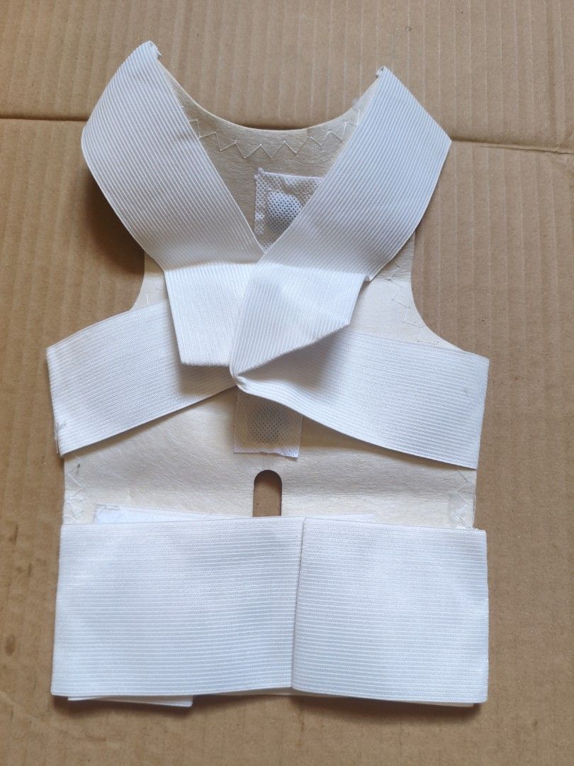 White Posture Corrector Back Brace (Category: Braces, Support & Protection) located in Pasig City. Submitted by coolphoenix-29ac (Listing ID 1435549539, Image 1). Description: - Adjustable straps for a customized fit - Vest-like design for comprehensive support - Made of soft, flexible material - Easy hook and loop closure - Designed to improve posture - Provides back support.