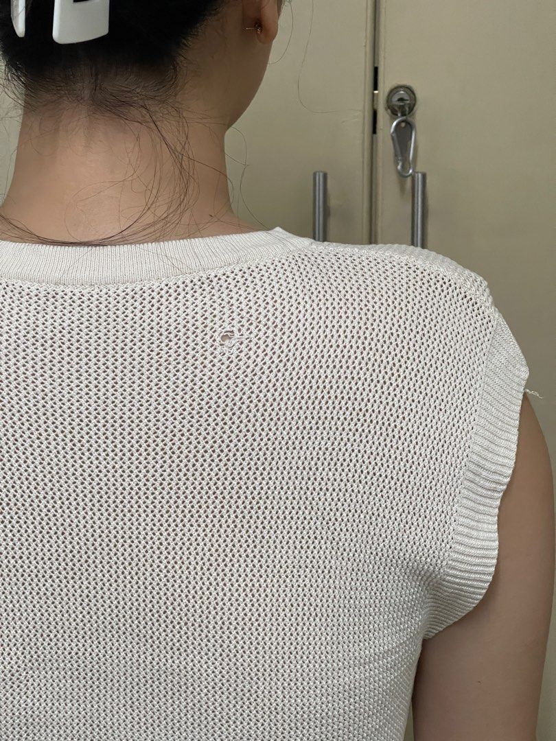 White Sleeveless Top with Rose Embroidery (Category: Sleeveless) located in Cavite. Submitted by ellanierva (Listing ID 1435553915, Image 2). Description: - White sleeveless top - Rose embroidery on front - Round neckline - Mesh-like knit - Small hole on the back - Neutral color - Small hole at the back as seen in the last photo.