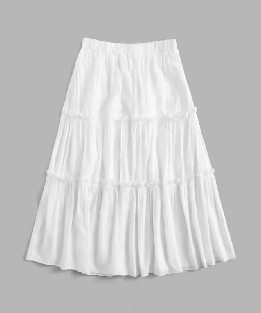 White Tiered Maxi Skirt (Category: Skirts) located in San Antonio. Submitted by lalisachu (Listing ID 1435525071, Image 2). Description: - White maxi skirt - Tiered design - Elastic waistband - Flowy and lightweight - Ideal for warm weather - Great for beach or casual wear - Easy to pair with different tops.