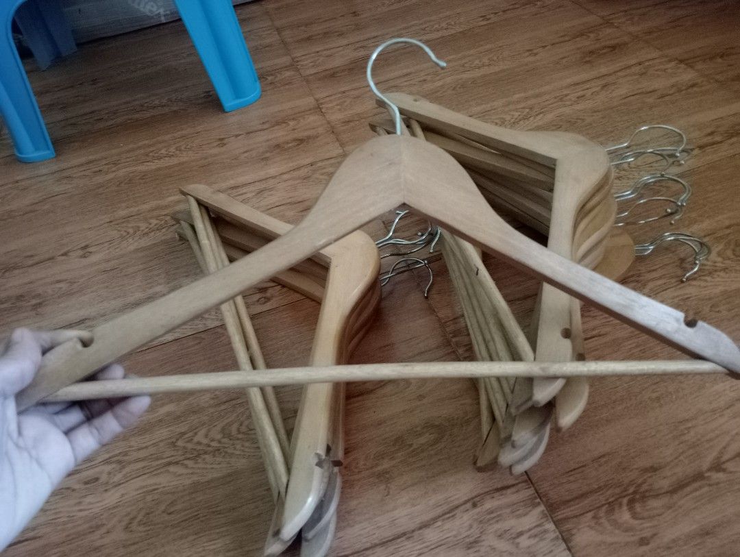 Wooden Clothes Hangers (Category: Hooks & Hangers) located in Quezon City. Submitted by rh_streetfashion (Listing ID 1435659820, Image 1). Description: - 20 pcs Set of wooden clothes hangers - Features a bar for pants and a hook for hanging - Made of wood with a natural finish - Suitable for various types of clothing.