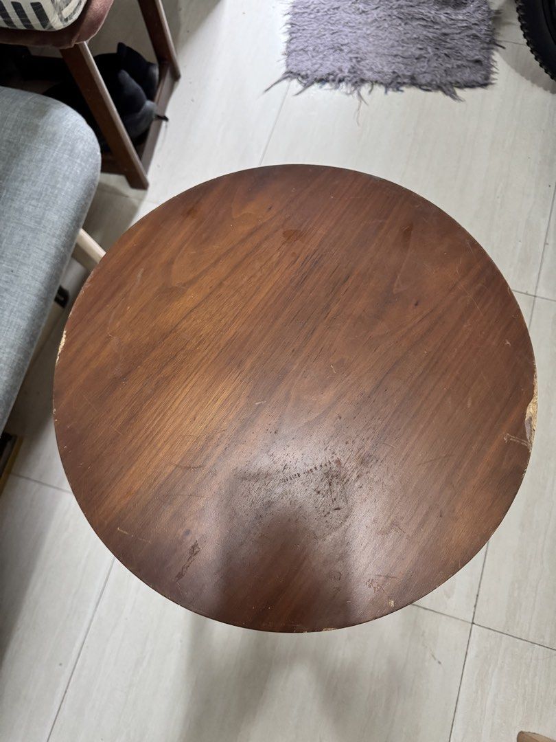 Wooden Side Table with Shelf (Category: Tables & Sets) located in Quezon City. Submitted by elektra0111 (Listing ID 1435713943, Image 3). Description: - Round tabletop - Lower shelf for storage - Classic design with angled legs - Warm brown finish - Versatile use: bedside table, accent piece - Practical and stylish - dimensions of the table Diameter 40cm Height 54cm.
