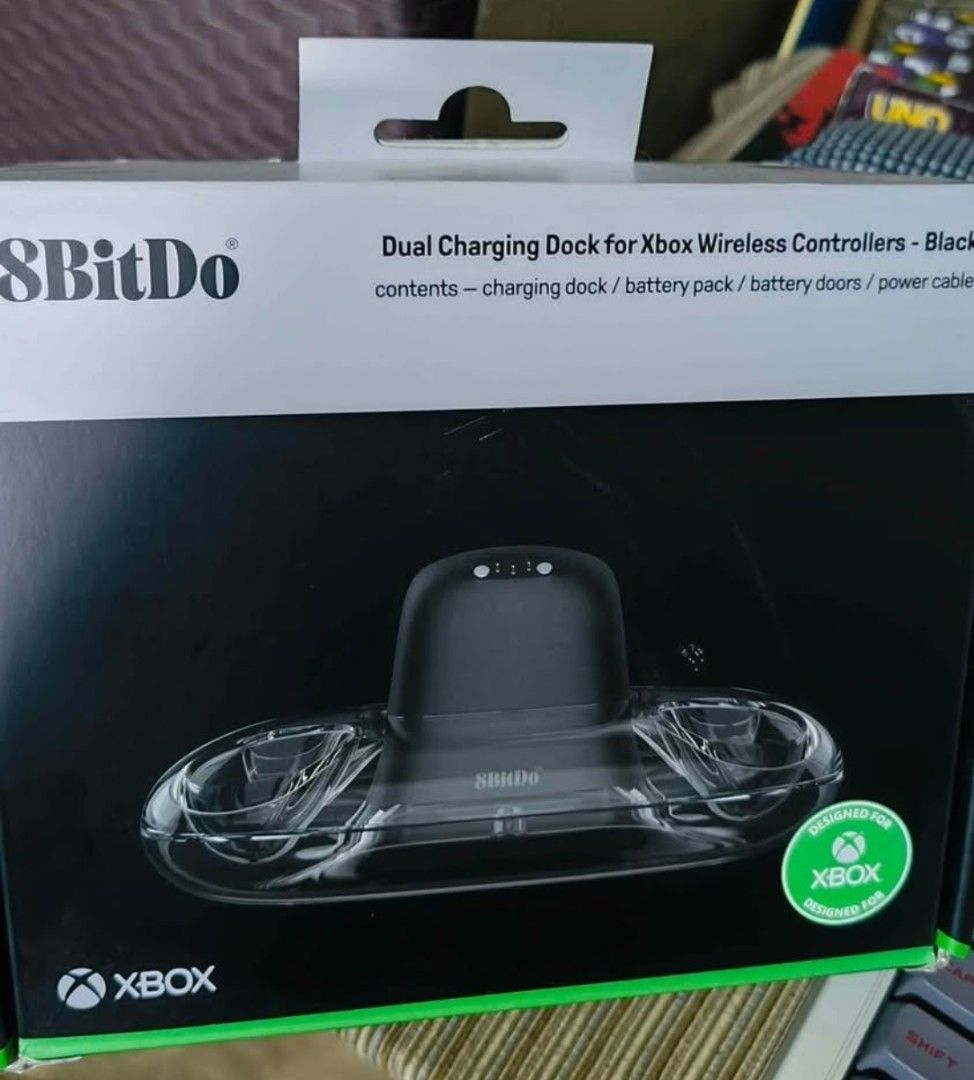 Xbox Controller Batteries (Category: Controllers) located in Manila. Submitted by rija41819 (Listing ID 1435568550, Image 1). Description: -4 xbox wireless controller batteries - 8BitDo Charging Dock for Xbox Wireless Controllers - Includes: Charging Dock, Battery Pack, Battery Doors, Power Cable - Features: - Overload Protection - Adjustable LED Brightness - Magnetic Connectors - Compatible with: Xbox Series X, Xbox Series S, Xbox One, Xbox Game