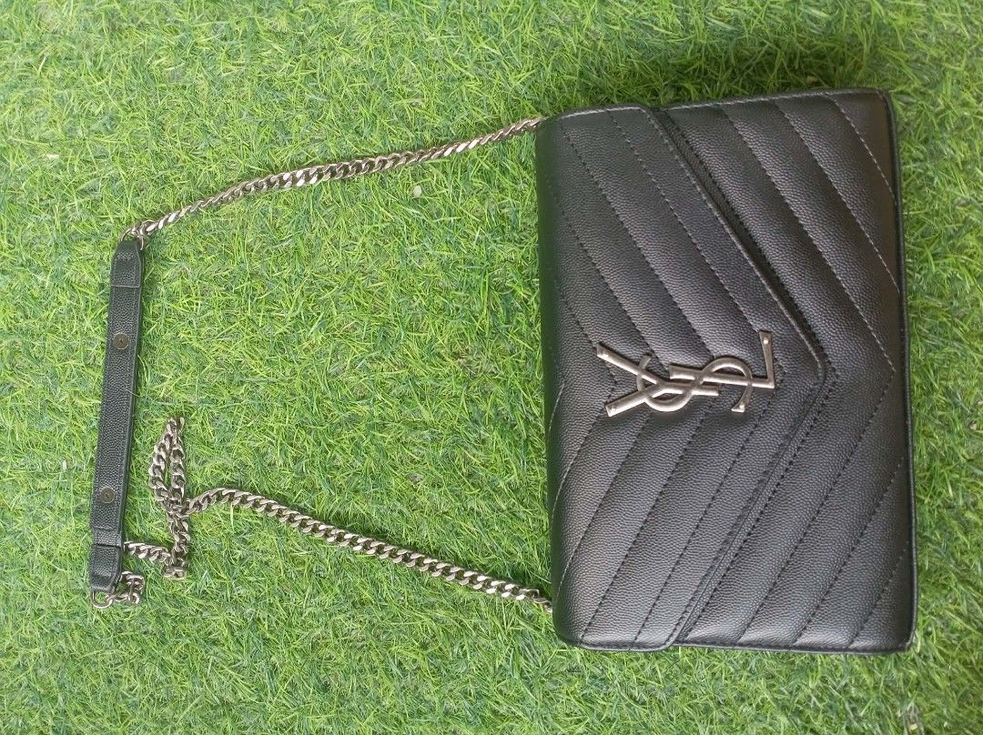 YSL Chain Wallet Bag (Category: Luxury Bags & Wallets) located in Manila. Submitted by michasi (Listing ID 1435666964, Image 2). Description: - Korea YSL chain wallet bag - Classic black color - Chevron-quilted design - Silver-tone chain strap with leather shoulder detail - Iconic YSL logo - Flap closure with multiple compartments.