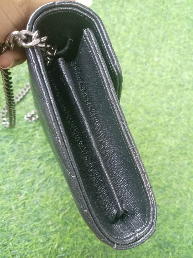 YSL Chain Wallet Bag (Category: Luxury Bags & Wallets) located in Manila. Submitted by michasi (Listing ID 1435666964, Image 3). Description: - Korea YSL chain wallet bag - Classic black color - Chevron-quilted design - Silver-tone chain strap with leather shoulder detail - Iconic YSL logo - Flap closure with multiple compartments.