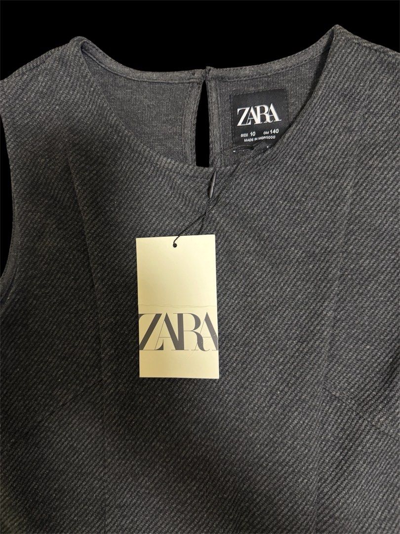 Zara Gray Pleated Dress (Category: Babies & Kids Fashion) located in Quezon City. Submitted by mcva2 (Listing ID 1435533281, Image 2). Description: - Zara gray dress - Pleated skirt - Sleeveless - Round neckline - Keyhole back - Side buckles - Size 10, 140cm height - Made in Morocco.