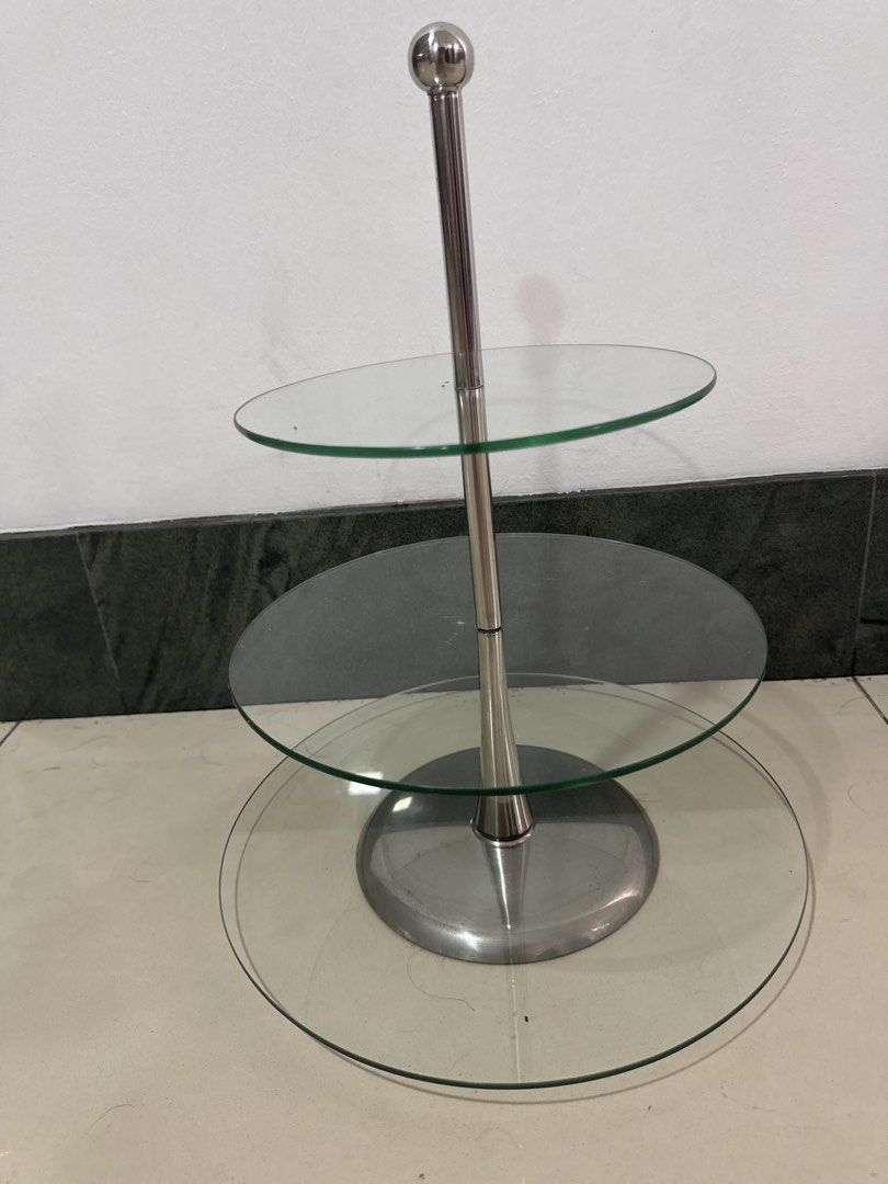 3-Tier Glass Cake Stand (Category: Other Kitchenware & Tableware) located in Manila. Submitted by decluterthings888 (Listing ID 1439057300, Image 2). Description: - 3-tier cake stand - Stainless steel frame - Clear glass plates - Ideal for desserts and appetizers - Sturdy base, sleek design - Easy to assemble - Easy to clean.