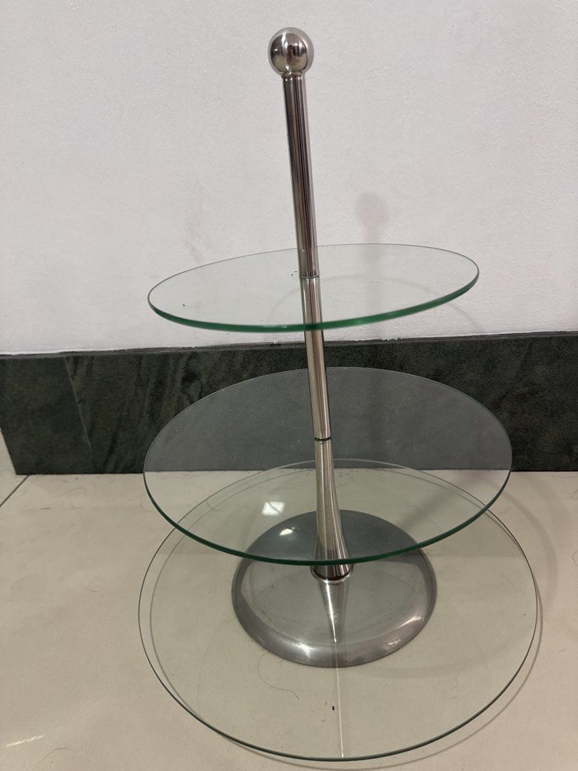 3-Tier Glass Cake Stand (Category: Other Kitchenware & Tableware) located in Manila. Submitted by decluterthings888 (Listing ID 1439057300, Image 1). Description: - 3-tier cake stand - Stainless steel frame - Clear glass plates - Ideal for desserts and appetizers - Sturdy base, sleek design - Easy to assemble - Easy to clean.
