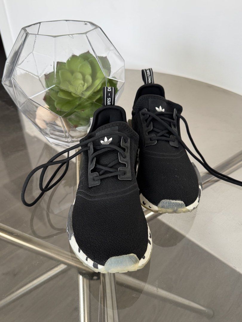 Adidas NMD R1 Black Sneakers (Category: Sneakers) located in Taguig. Submitted by kittychum (Listing ID 1439009123, Image 1). Description: 💯 AUTHENTIC SIZE: MEN US 6 - Adidas NMD R1 sneakers - Color: Black - Adidas logo on tongue and heel - Sole with white and black pattern (Oreo) - Signs of wear on soles.