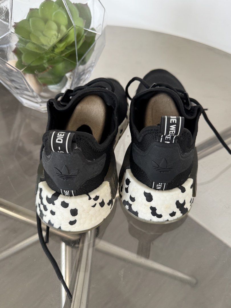 Adidas NMD R1 Black Sneakers (Category: Sneakers) located in Taguig. Submitted by kittychum (Listing ID 1439009123, Image 2). Description: 💯 AUTHENTIC SIZE: MEN US 6 - Adidas NMD R1 sneakers - Color: Black - Adidas logo on tongue and heel - Sole with white and black pattern (Oreo) - Signs of wear on soles.