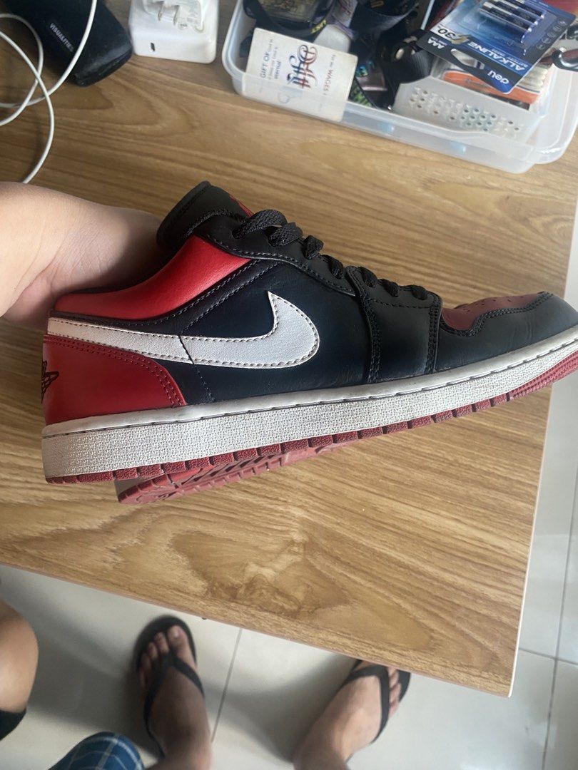 Air Jordan 1 Low Black Red (Category: Sneakers) located in Manila. Submitted by tonymagban96143 (Listing ID 1438955998, Image 2). Description: - Air Jordan 1 Low - Colorway: Black and Red - Size: US 8 - White Nike swoosh - Black laces - Red Jumpman logo on tongue - White soles with red accents .