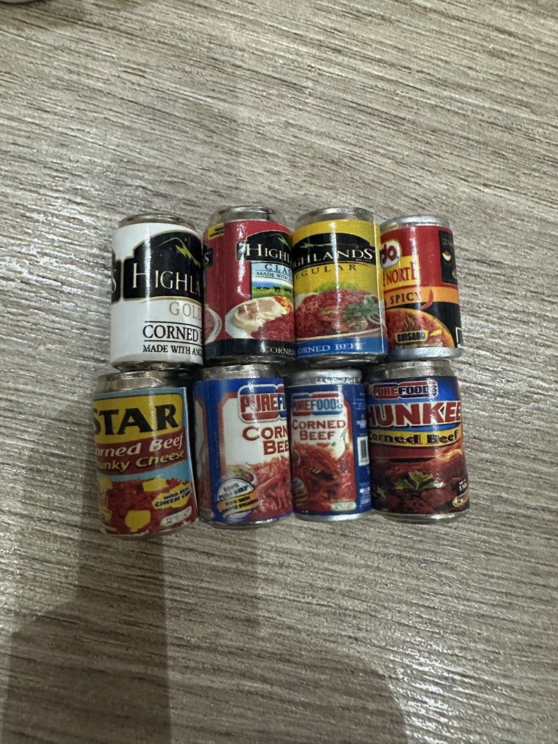 Assorted Corned Beef Canned Goods (Category: Packaged & Instant Food) located in Muntinlupa City. Submitted by camotepie (Listing ID 1439008301, Image 1). Description: - Assorted corned beef brands: Highlands, Star, Purefoods, Hunker - Varieties: Regular, Spicy, Chunky Cheese - Perfect for: - Stocking your pantry - Miniature food collectors.