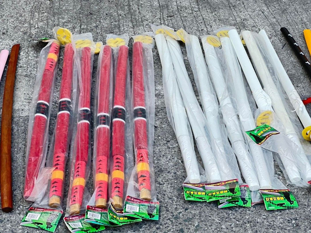 Assorted Toy Swords (Category: Toys & Games) located in Valenzuela. Submitted by upcycle_things (Listing ID 1438967757, Image 3). Description: - Assorted toy swords - Colors: White, yellow, red, black, and blue - Designs: Katana-like styles - Some swords are in plastic packaging - Great for kids' play and cosplay.