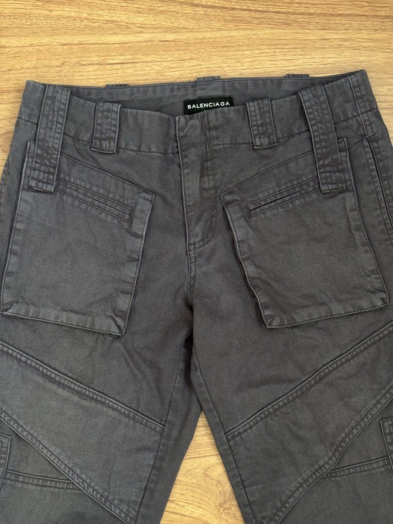Balenciaga Straight Fit Cargo Pants (Category: Chinos) located in Taguig. Submitted by mariow (Listing ID 1438974442, Image 3). Description: Thrifted, source unknown Unisex style No size tag or washtag, label looks like it was from Alexander Wang era When worn 7-8th photos Waist: 14.5 in across Rise: 11.5 in Hem: 8in Total length: 36in - Balenciaga gray cargo pants - Multiple functional pockets - Distinctive style with visible stitching - Balenci
