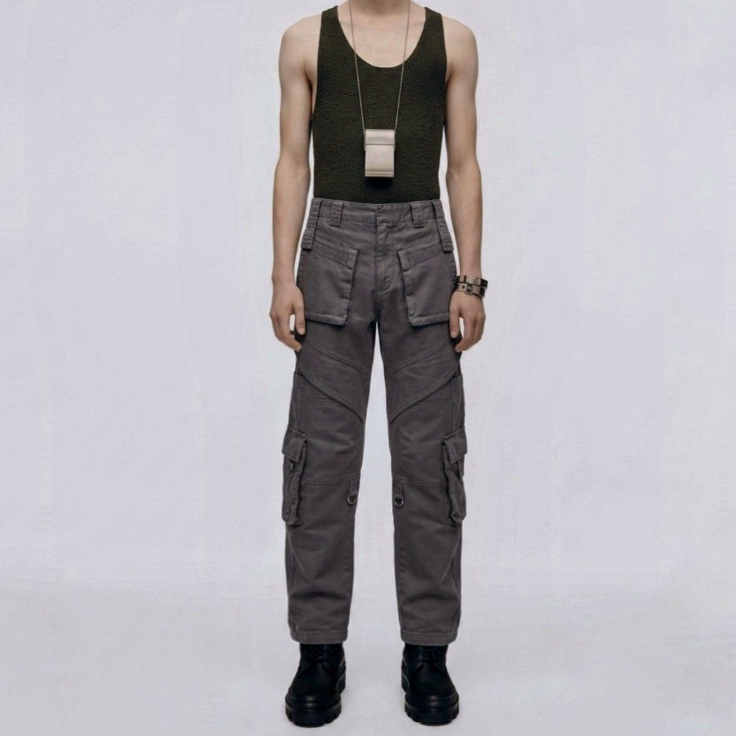 Balenciaga Straight Fit Cargo Pants (Category: Chinos) located in Taguig. Submitted by mariow (Listing ID 1438974442, Image 1). Description: Thrifted, source unknown Unisex style No size tag or washtag, label looks like it was from Alexander Wang era When worn 7-8th photos Waist: 14.5 in across Rise: 11.5 in Hem: 8in Total length: 36in - Balenciaga gray cargo pants - Multiple functional pockets - Distinctive style with visible stitching - Balenci