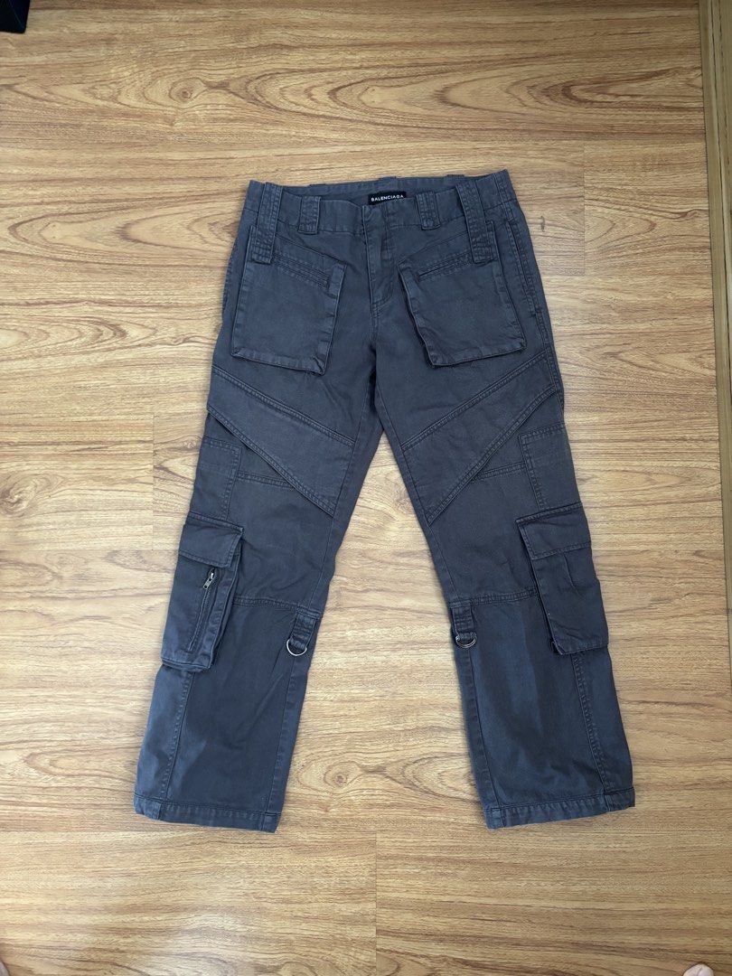 Balenciaga Straight Fit Cargo Pants (Category: Chinos) located in Taguig. Submitted by mariow (Listing ID 1438974442, Image 2). Description: Thrifted, source unknown Unisex style No size tag or washtag, label looks like it was from Alexander Wang era When worn 7-8th photos Waist: 14.5 in across Rise: 11.5 in Hem: 8in Total length: 36in - Balenciaga gray cargo pants - Multiple functional pockets - Distinctive style with visible stitching - Balenci