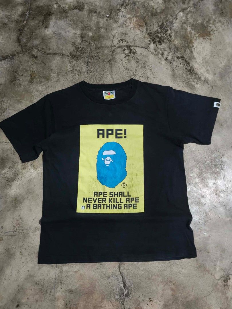 BAPE APE Never Kill Ape T-shirt (Category: Tshirts & Polo Shirts ) located in Caloocan City. Submitted by thriftjohn (Listing ID 1438882330, Image 1). Description: - Black BAPE t-shirt - Features a blue ape head graphic on the front - Text: "APE! APE SHALL NEVER KILL APE OR A BATHING APE" - Short sleeves - Includes BAPE logo tag on the sleeve - Small tag on the collar.