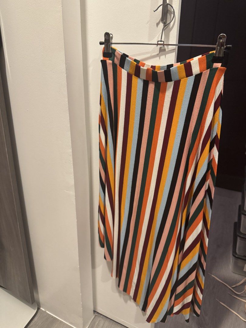 Bershka Striped Midi Skirt (Category: Skirts) located in Taguig. Submitted by kittychum (Listing ID 1439012174, Image 1). Description: - Bershka midi skirt - Colorful striped design - Asymmetrical hem - Size: S - Made in Turkey - Comfortable elastic waistband - Versatile style.