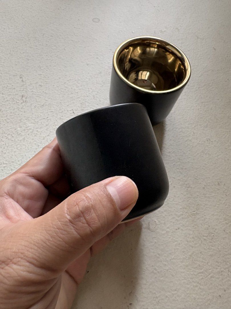 Black and Gold Double-Wall Espresso Cup (Category: Coffee & Tea Tableware) located in Mandaluyong City. Submitted by material_boi (Listing ID 1438912622, Image 3). Description: Bought in Rustan’s for ₱1,900. Super luxurious looking. Matte black exterior and polished gold interior. Not sure if this is stoneware or porcelain pero medyo mabigat to so I think this is stoneware. Rarely use it now since I shifted to brewing coffee. Maganda ang double w