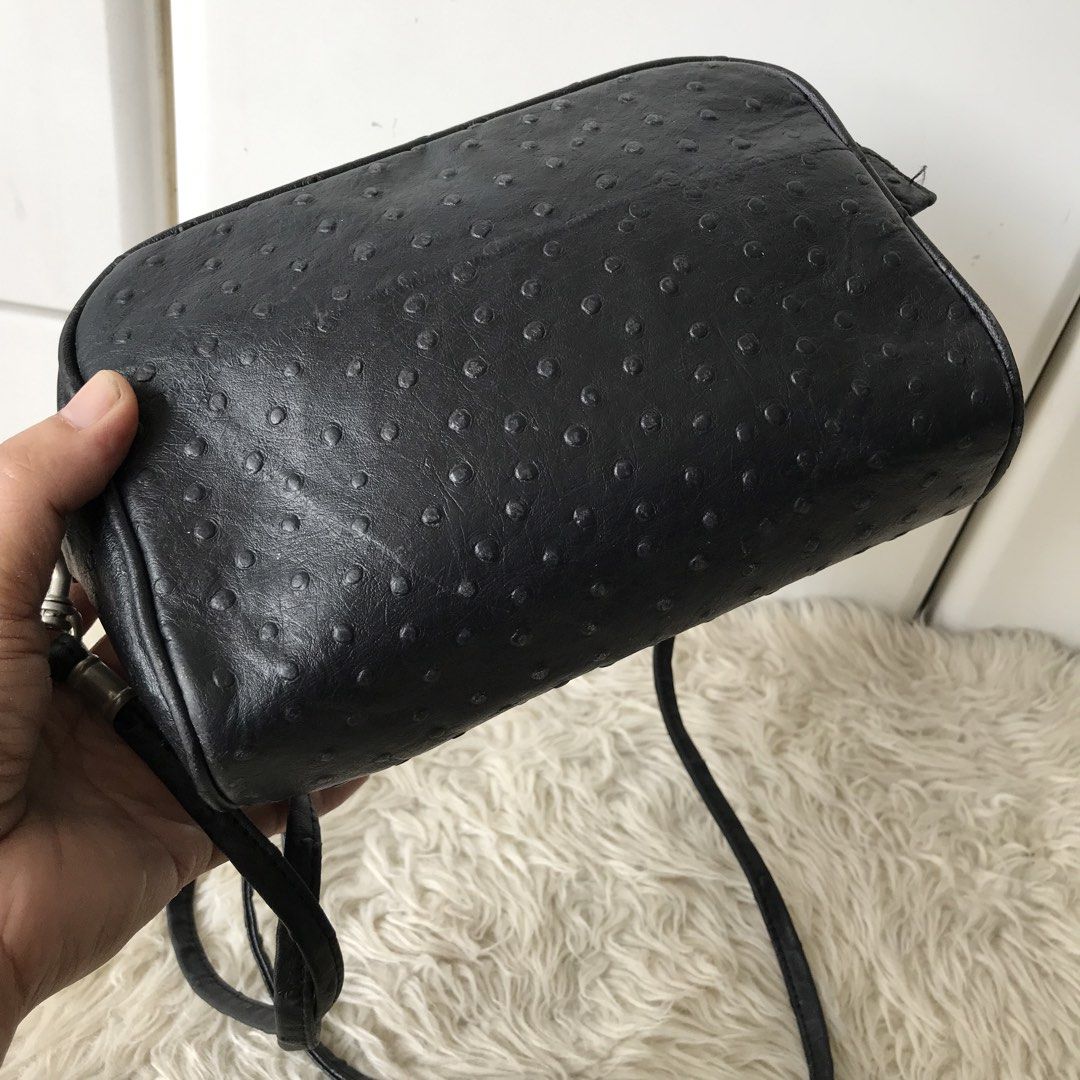 Black Ostrich-Embossed Crossbody Bag (Category: Cross-body Bags) located in Baao. Submitted by all.things.japan (Listing ID 1438985271, Image 3). Description: - 8.0 x 2.25 x 5.25 inches - Black crossbody bag - Ostrich-embossed texture - Zippered closure - Adjustable long strap - Silver-toned hardware - Made of leather - Rectangular shape.