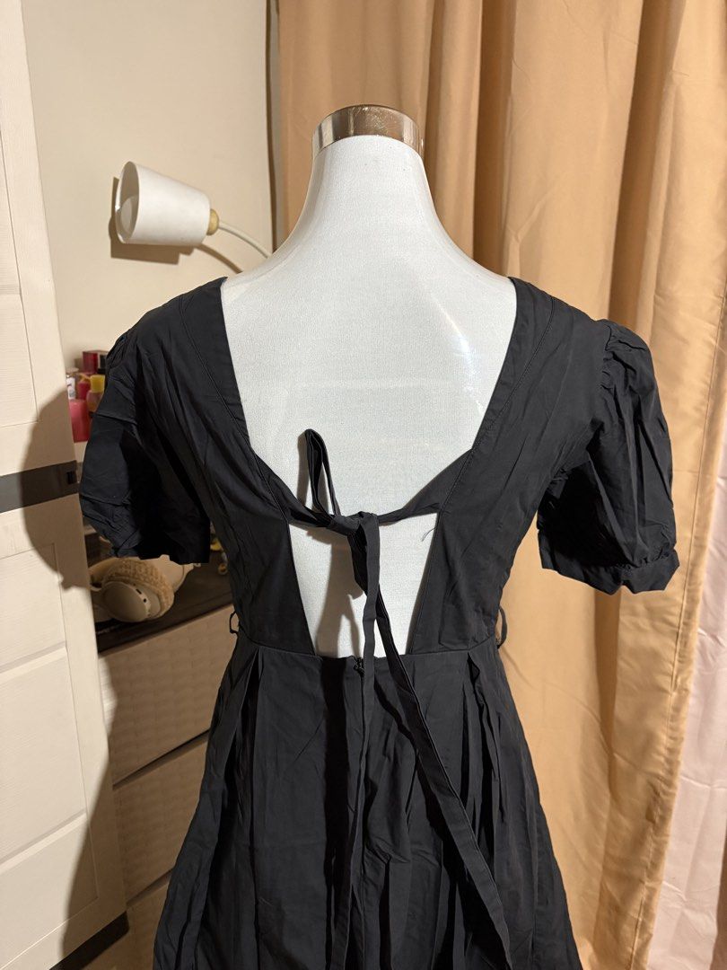 Black Square Neck Puff Sleeve Dress (Category: Dresses) located in Antipolo. Submitted by pjpiii (Listing ID 1438993010, Image 2). Description: 100 each dress Black dress with a square neckline and puff sleeves. Features a tie-back detail. The dress has a flared skirt. Perfect for casual wear or dressing up..