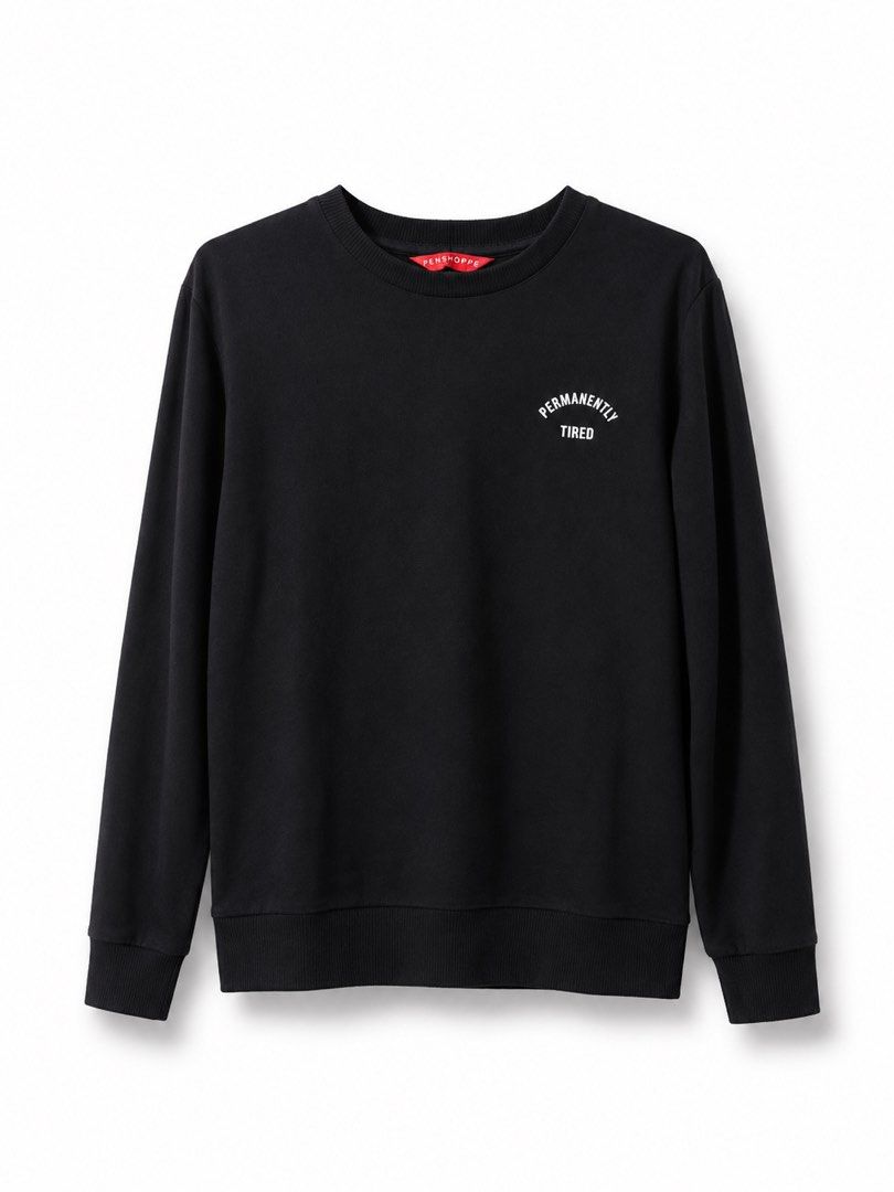 Black Sweatshirt with "Permanently Tired" Print (Category: Coats, Jackets and Outerwear) located in Taguig. Submitted by julia_choose (Listing ID 1438926562, Image 1). Description: - Black crew neck sweatshirt - Features a small "permanently tired" print on the chest - Long sleeves - Brand: PENSHOPPE - Comfortable fabric - Perfect for casual wear - Simple and stylish design.