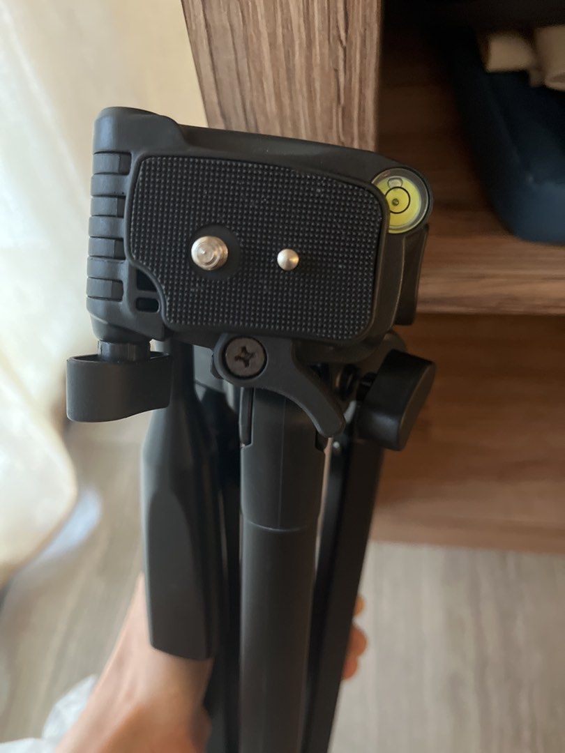 Black Tripod - Adjustable Height (Category: Tripods & Monopods) located in Singapore. Submitted by jasmj (Listing ID 1438972034, Image 3). Description: Up to 1.5M with two adjustable height options. Stable and lightweight with a level at the top. .