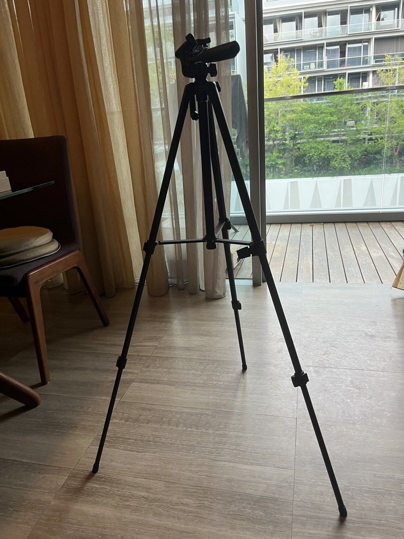 Black Tripod - Adjustable Height (Category: Tripods & Monopods) located in Singapore. Submitted by jasmj (Listing ID 1438972034, Image 2). Description: Up to 1.5M with two adjustable height options. Stable and lightweight with a level at the top. .